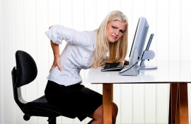 Woman with pain in the back office